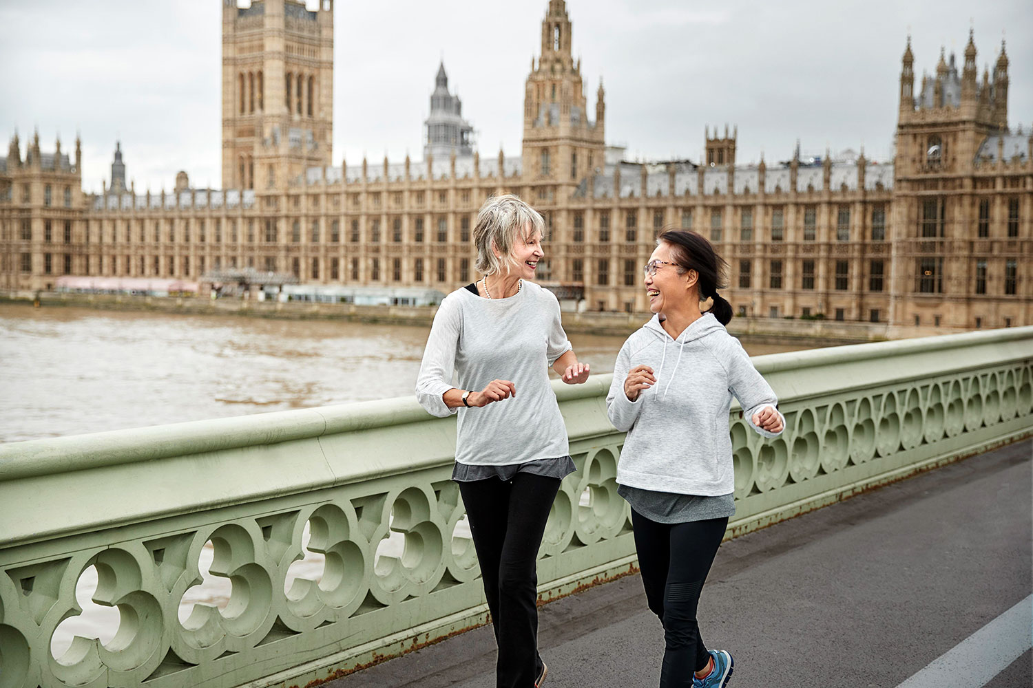 Women running in London Laughing